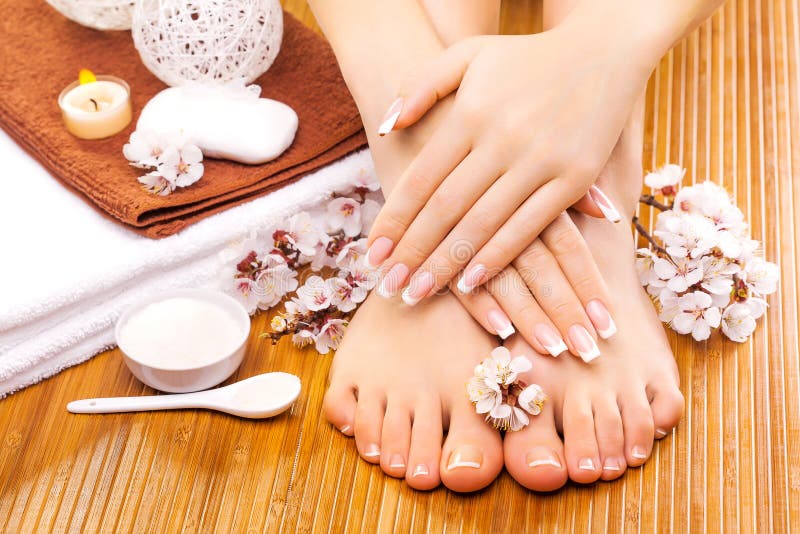 Brown manicure and pedicure on the bamboo royalty free stock images Brown manicure and pedicure on the bamboo royalty free stock images