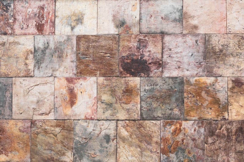 Brown old stone wall, vintage texture, bricks surface, abstract grunge background, square tile pattern, rough granite. Buildings royalty free stock photos