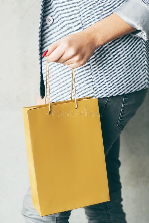 Brown paper bag woman hand consumerism shopping stock image Brown paper bag woman hand consumerism shopping stock image