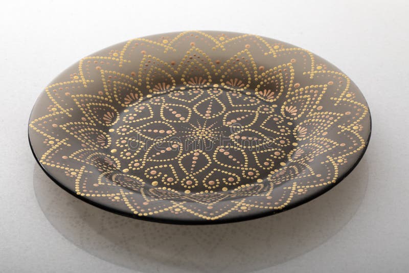 Brown Plate on a White Background with a Geometric Pattern. Stock Image