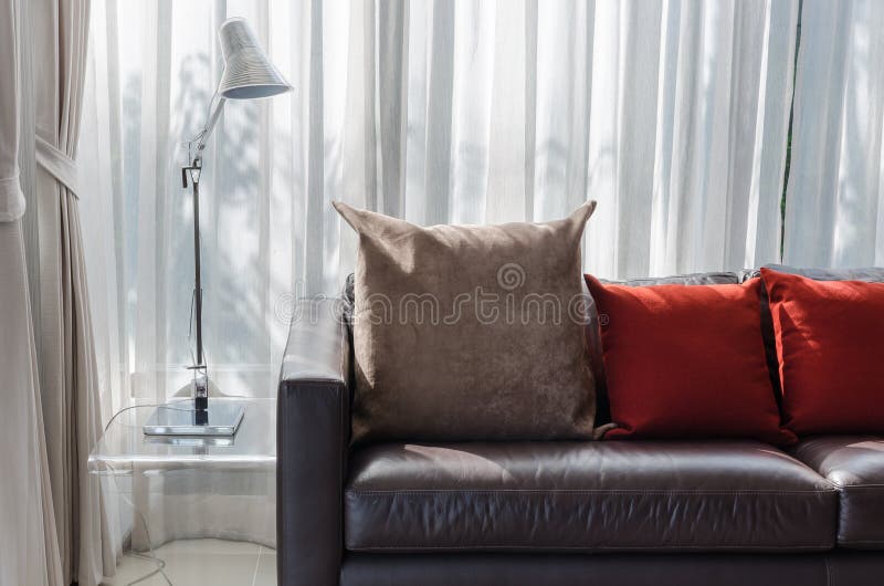 Red Pillow on a Sofa stock photo. Image of upscale, chic 1003254
