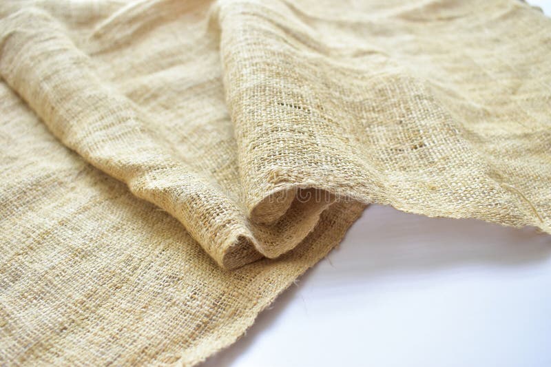 Close up brown sackcloth texture background, crumpled burlap fabric textile for design