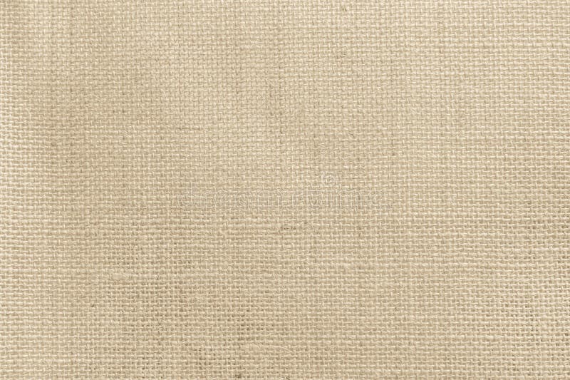 Brown sackcloth woven texture background in natural pattern. Jute hessian burlap, linen background in light beige cream color royalty free stock photography