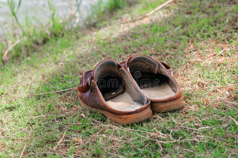 Old shoes in the grass stock photo. Image of shoe, agricultural - 55485048