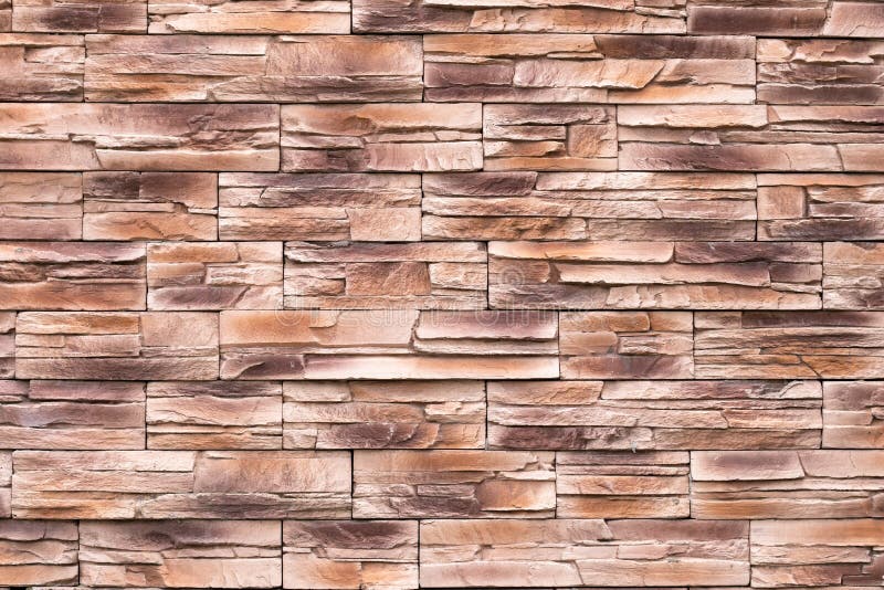 Brown stone wall texture, uneven surface, grunge brick background, abstract pattern, rocks surface, rough granite. Buildings royalty free stock image