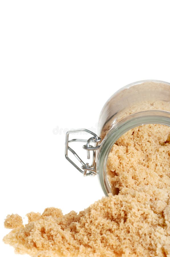Isolated brown sugar focus on jar with white background