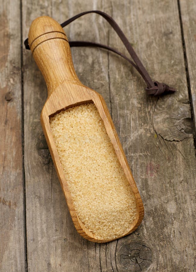 Brown sugar scoop stock image. Image of sweet, pouring 112985381