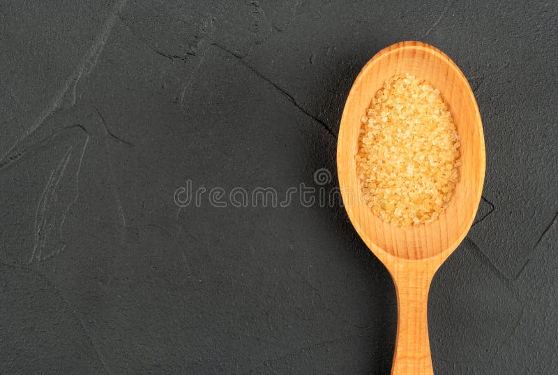 Brown sugar in spoon stock photo. Image of kitchen, energy 198358866