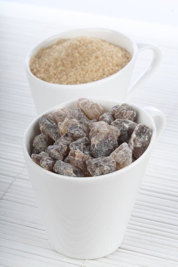 Sugarcane Cups With Paper Holders With Bamboo Utensils On Palm Of A