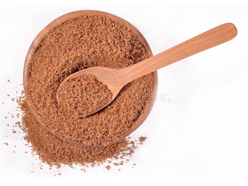 Brown sugar in a wooden bowl on a white stock photography