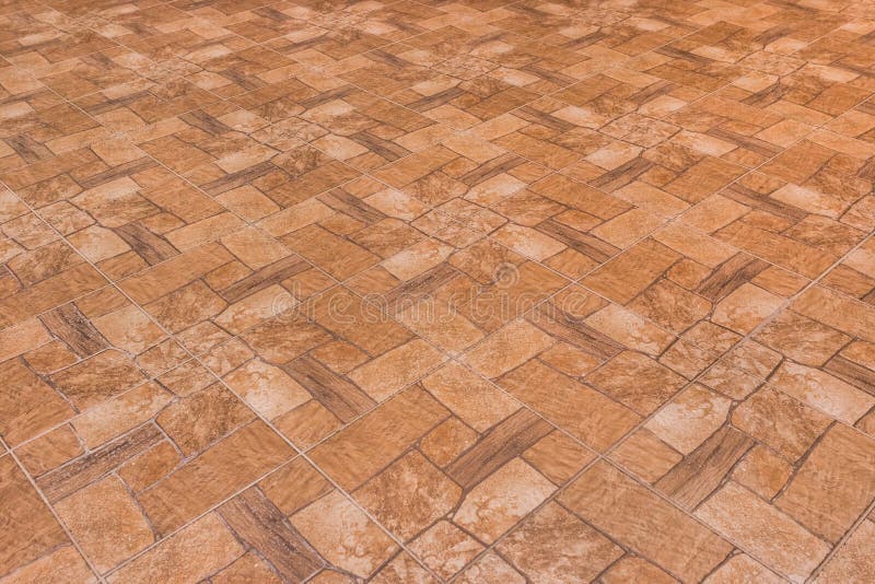 Brown tile floor with abstract pattern of stone surface texture background stock photography