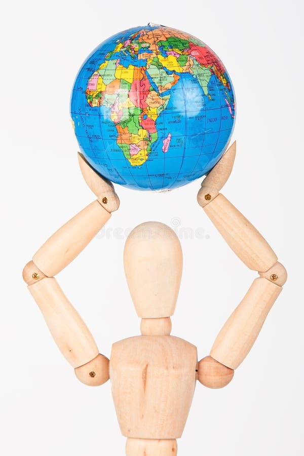 Brown wood mannequin holding concerned a globe protect royalty free stock image
