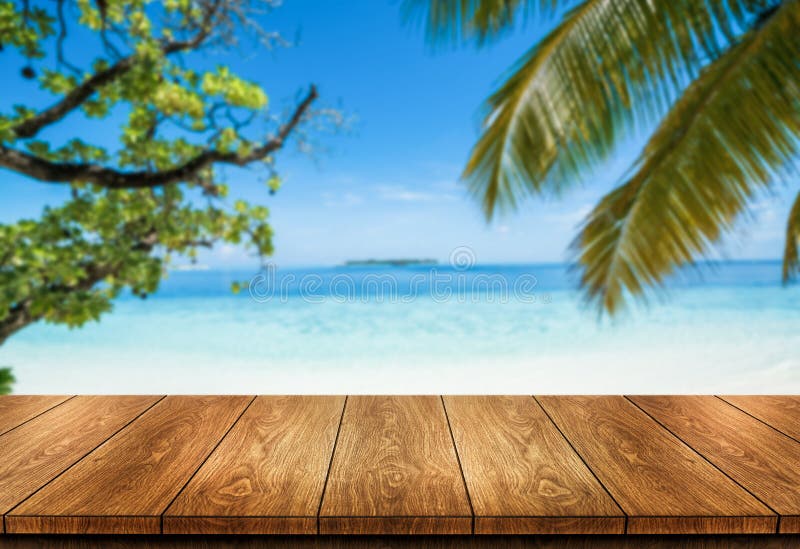 Brown wood table on summer tropical beach