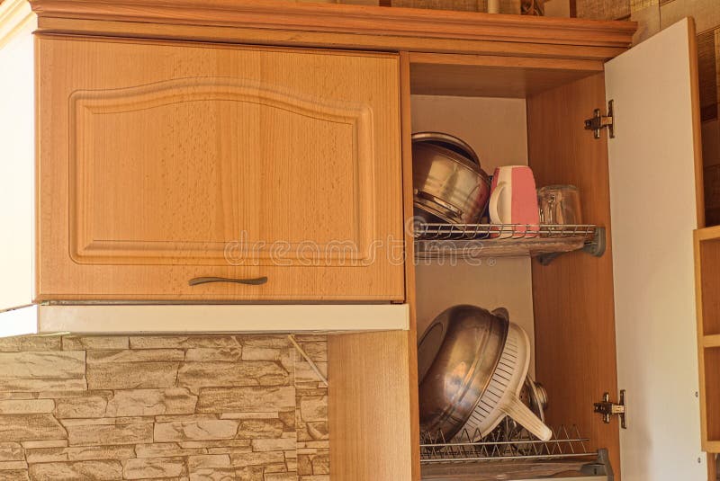 Brown Wooden with Dishes Hanging on the Wall Stock Image