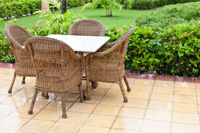 Brown wooden chairs an tables on patio