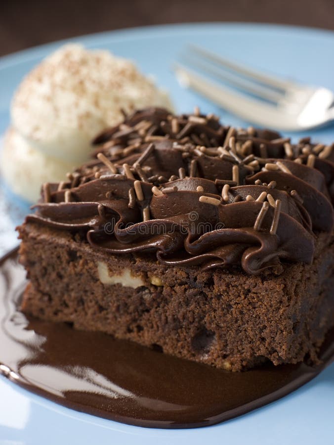 Chocolate Fudge Brownie With Chocolate Fudge Sauce And Cream. Chocolate Fudge Brownie With Chocolate Fudge Sauce And Cream