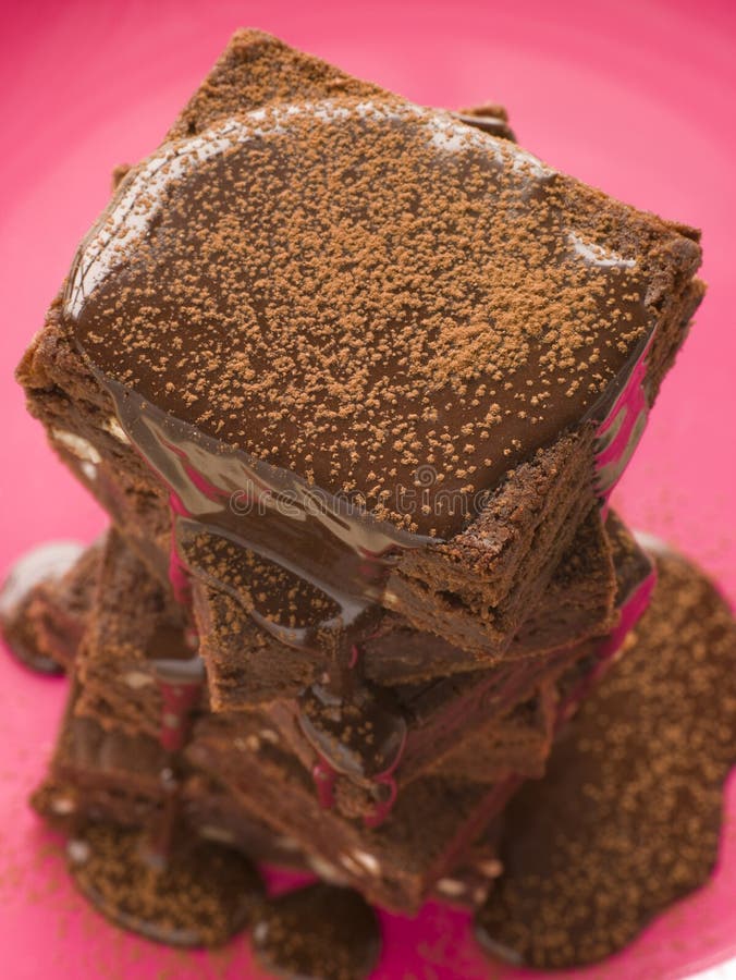 High Angle View Of Chocolate Fudge Brownies With Chocolate Fudge Sauce. High Angle View Of Chocolate Fudge Brownies With Chocolate Fudge Sauce