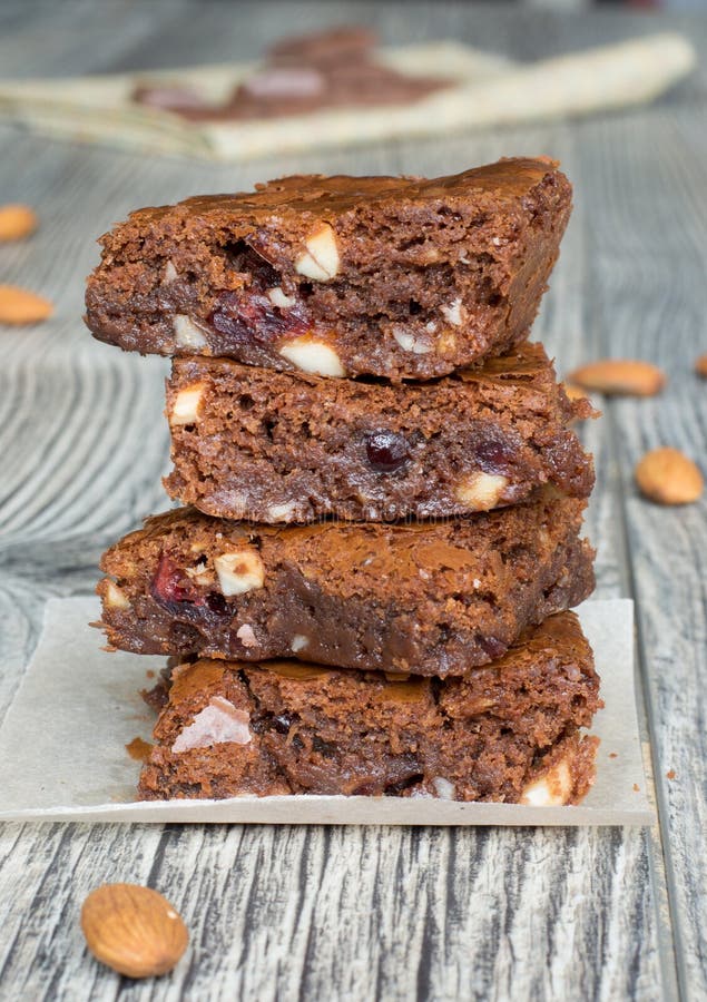 Tasty chocolate brownies with almonds and dry cranberries. Tasty chocolate brownies with almonds and dry cranberries