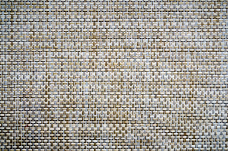 Bruin-geel-beige rieten, plastic grill, textuur royalty-vrije stock afbeelding Bruin-geel-beige rieten, plastic grill, textuur royalty-vrije stock afbeelding