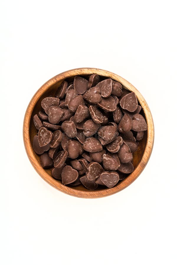 Brun formad godishjärta mjölkar stycken för chokladchip arkivfoton Brun formad godishjärta mjölkar stycken för chokladchip arkivfoton
