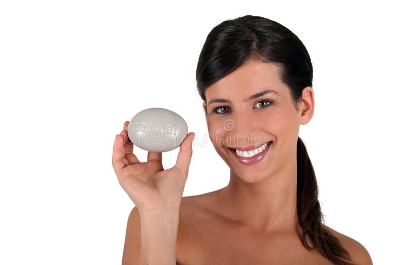 Brunette all smiles holding soap