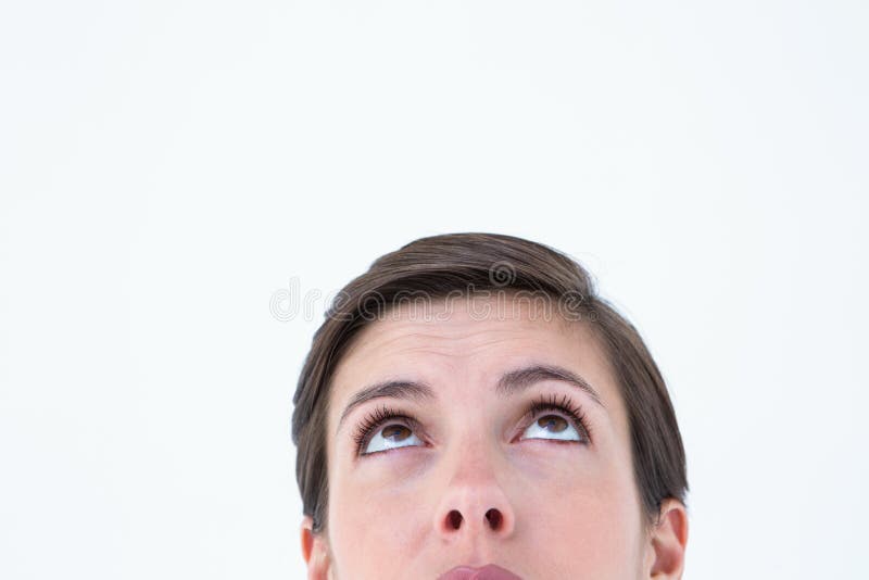 Brunette bonito que olha acima imagem de stock royalty free Brunette bonito que olha acima imagem de stock royalty free