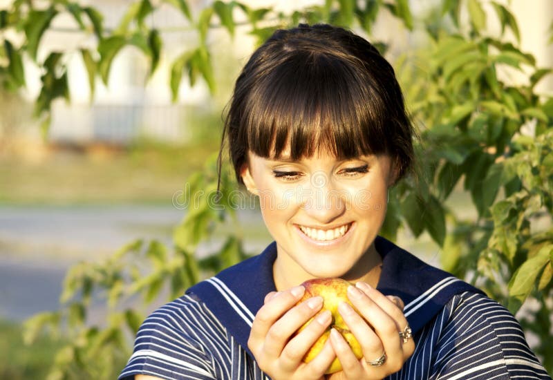 Brunette girl and apple