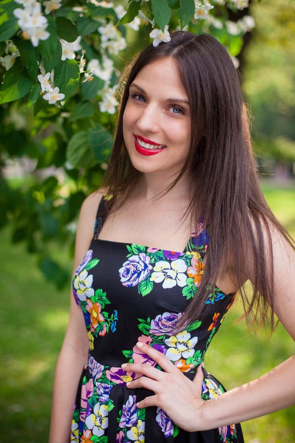 Brunette Girl In The Park Wearing Black Dress With Flowers Stock Image Image Of Open Dress