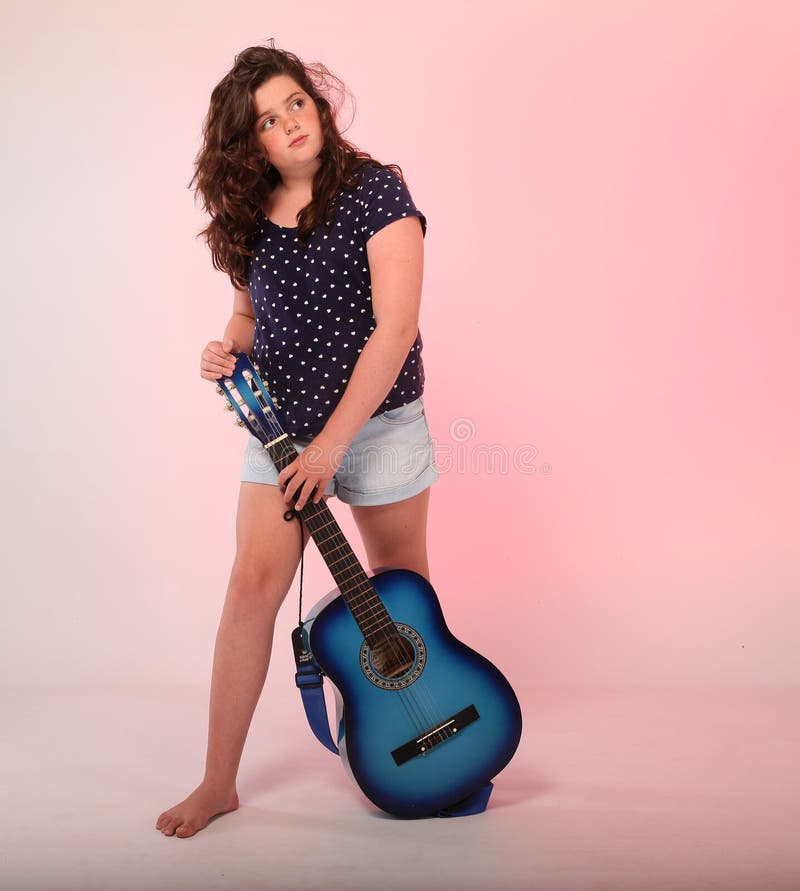 Brunette girl playing blue guitar