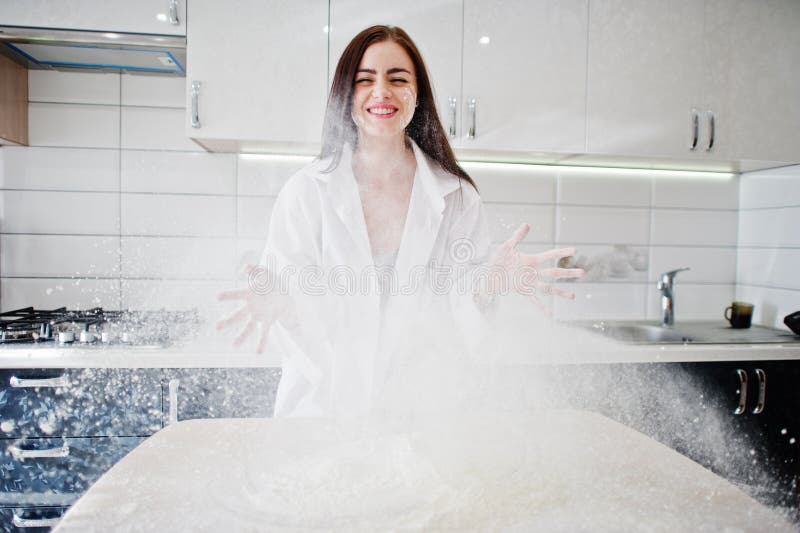 Brunette Girl Wear At Shirt And Underwear Cooking At Kitchen Stock