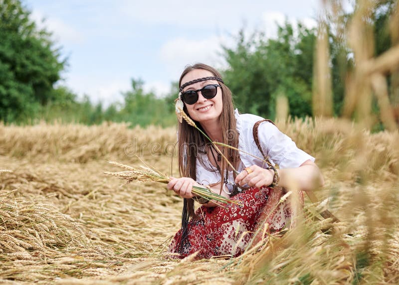 Brunette Hippie Woman, Wearing Boho Style Clothes, Squatting Down
