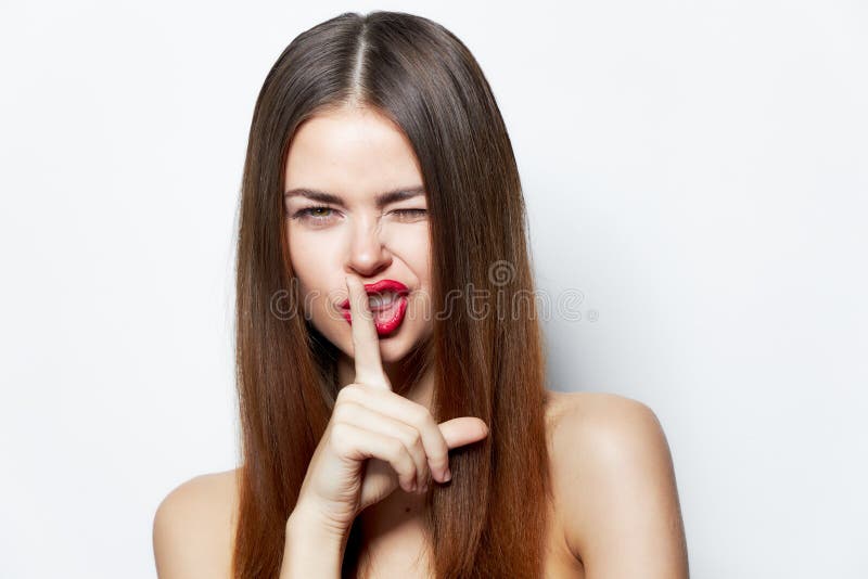 Brunette Holds Her Finger Near Her Lips And Winks Stock Image Image Of Person Hair 197033241