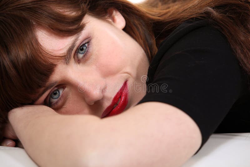 Brunette laying down stock photo
