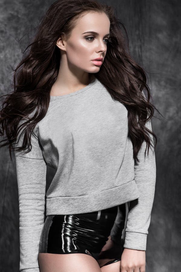 Brunette model in fashion clothes stock image Brunette model in fashion clothes stock image