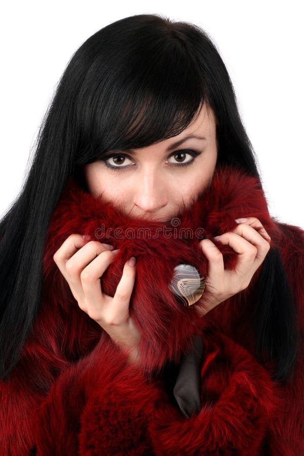 Brunette is in a red fur coat