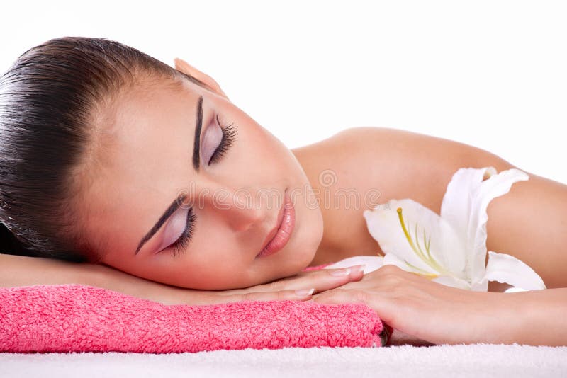 Brunette spa woman in towel on head