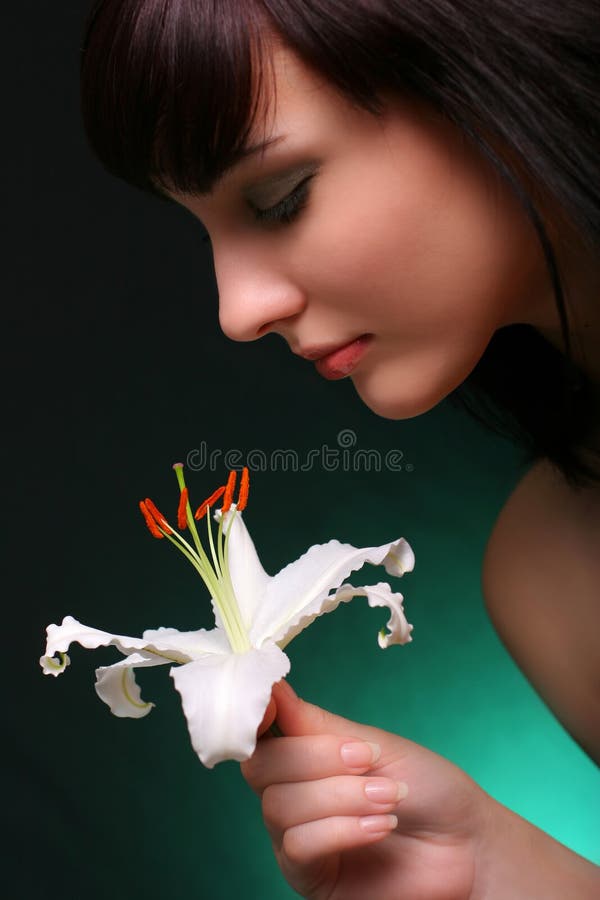 Brunette with white lily flowers