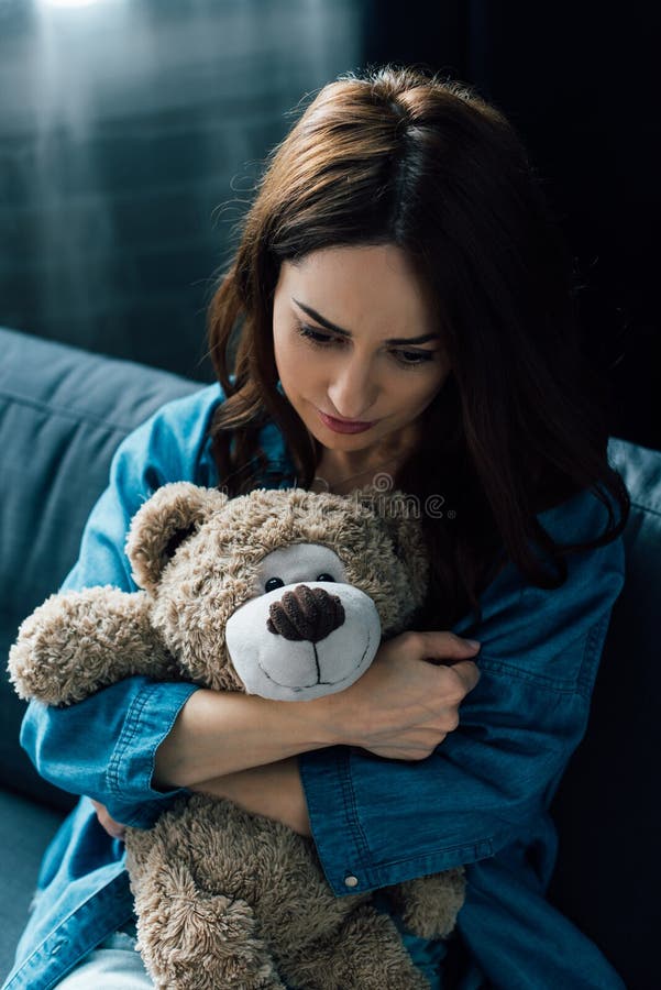Woman Holding Teddy Bear and Stock Photo Image of depression