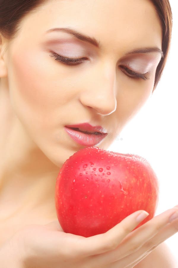 Brunette woman with red apple