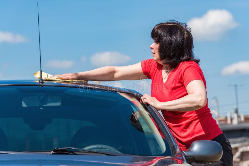 Brunette Woman Washes Her Car Stock Image - Image of grime, holding