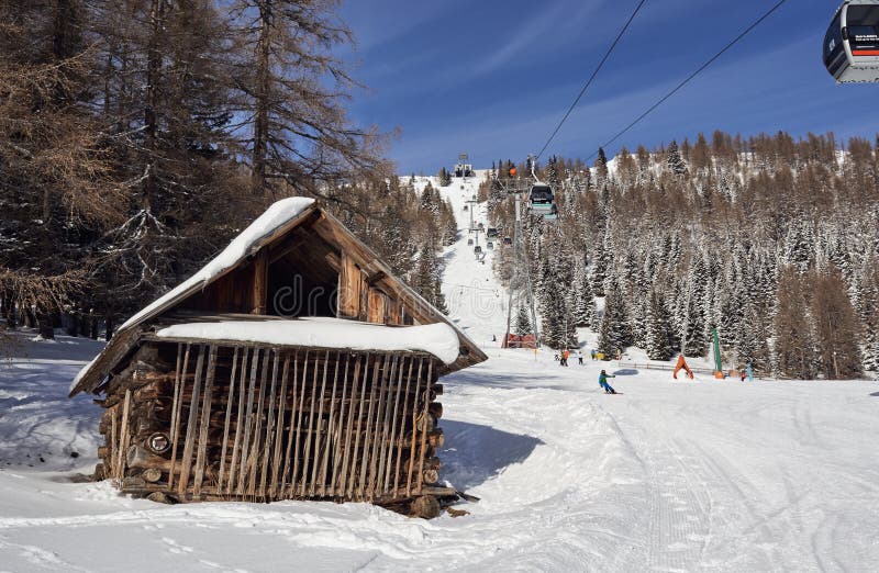 Brunnach Ski Resort, St. Oswald, Carinthia, Austria - January 20, 2019: Captured a vintage cabin in the forest beside the slope royalty free stock image