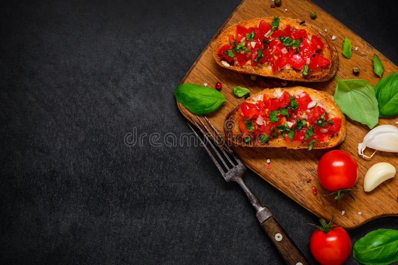 Bruschetta Antipasto with Tomato and Basil on Copy Space royalty free stock image Bruschetta Antipasto with Tomato and Basil on Copy Space royalty free stock image