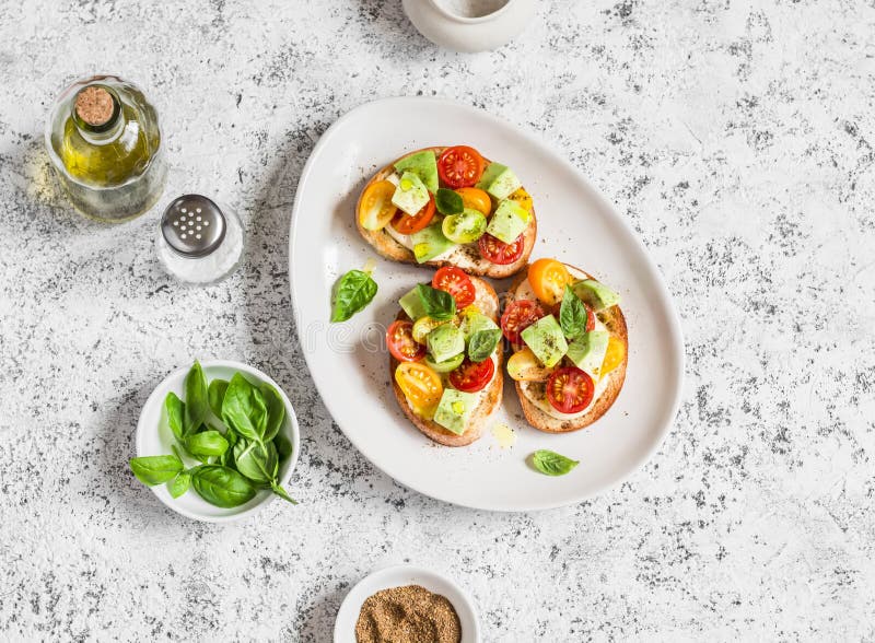 Bruschetta with cherry tomatoes, avocado and basil. stock photography Bruschetta with cherry tomatoes, avocado and basil. stock photography