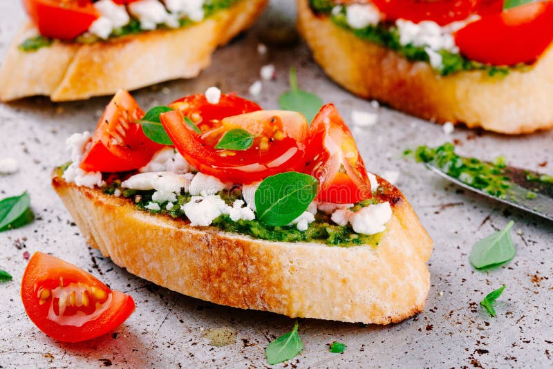 Bruschetta with Pesto Sauce, Feta Cheese, Tomatoes and Basil Stock ...