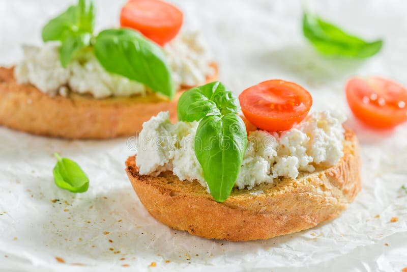 Bruschetta with Ricotta Cheese and Tomato Stock Photo Image of