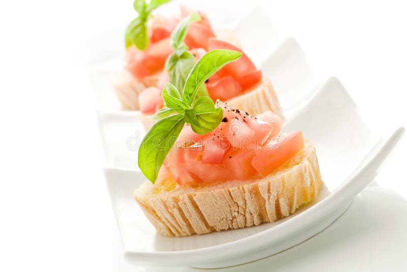 Bruschetta with tomatoes and basil isolated