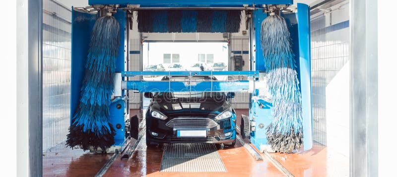 Brush Turning in Car Wash with Vehicle in it Stock Image Image of