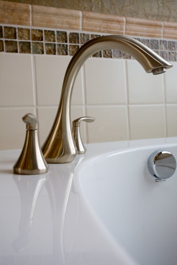 Bathtub faucet stock image. Image of bath, tile, nickle 23959911