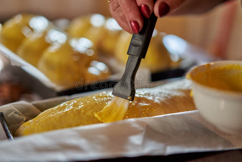 Brushing the Cakes with Egg Yolk Stock Photo Image of person