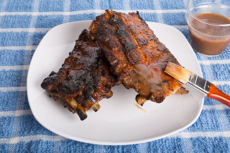 Brushing Sauce on Barbecue Ribs Stock Image Image of food, grilled